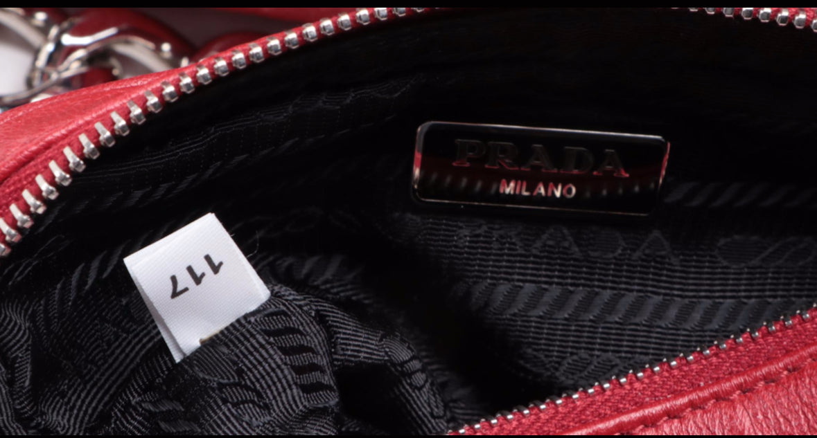 Prada Vitello Daino Grommet Chain Bag